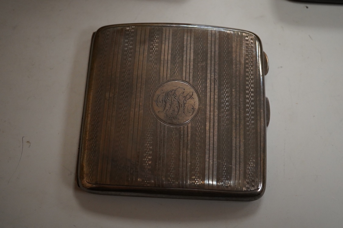 A cased engine turned sterling cigarette case, 11.4cm, a George V silver cigarette case and a cased commemorative limited edition silver gilt Churchill Centenary Picture Medal.